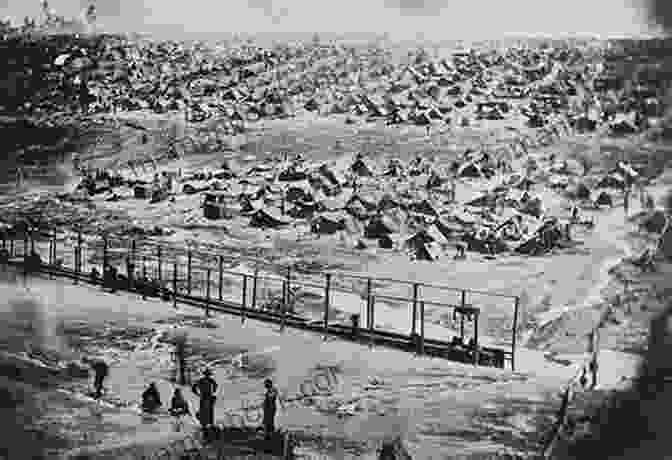 A Black And White Photograph Of The Andersonville Prison Camp During The Civil War, With Rows Of Wooden Barracks And A Guard Tower In The Background Andersonville Memories: Andersonville Dreams