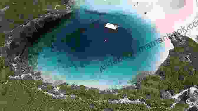 Aerial View Of The Blue Hole In The Bahamas, Showcasing Its Striking Blue Color And Cylindrical Shape. The Blue Hole: A Bahamian Short Story